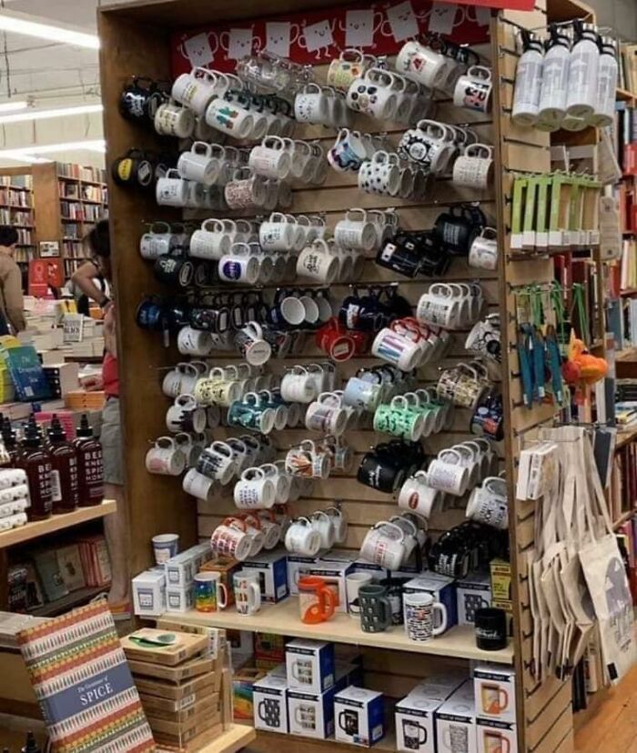 Optical illusion of mugs arranged on a display rack creating an intriguing pattern.