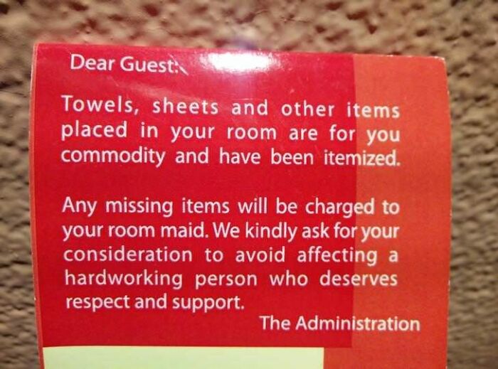 A sign from hotel administration about missing items charged to the room maid, highlighting a sad world situation.