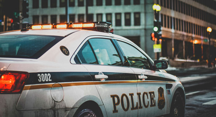 A police car, representing consequences and karma.