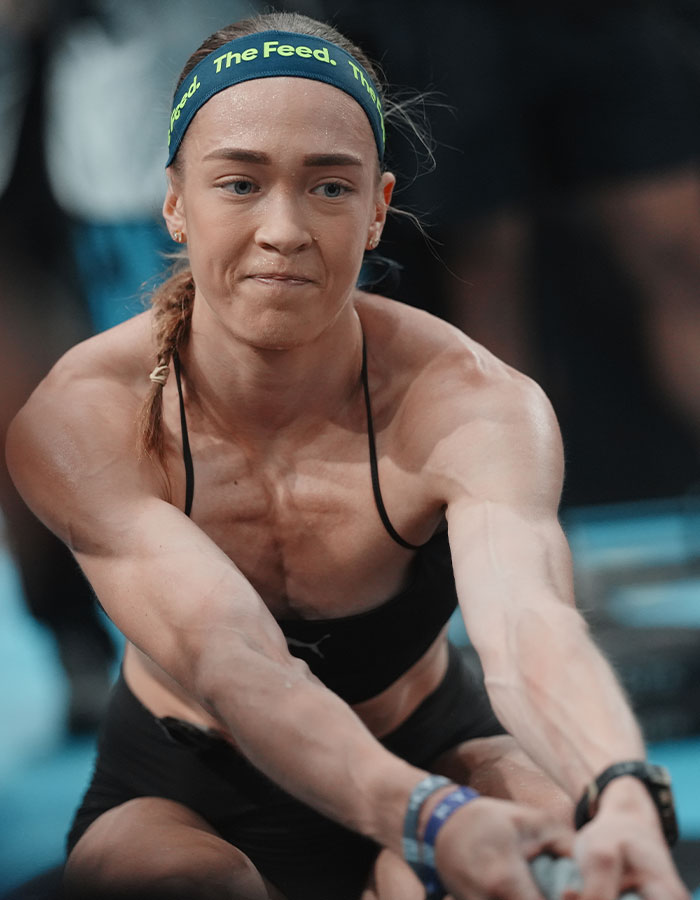 HYROX athlete focused during a race, showing intense concentration and physical exertion.