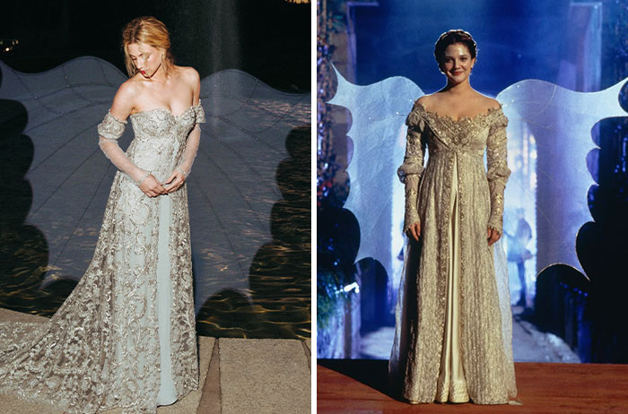 Hollywood star recreating iconic movie looks in a silver gown with wings next to Drew Barrymore in Ever After