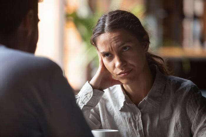 Woman looking annoyed, perhaps due to things people do that others judge them for.