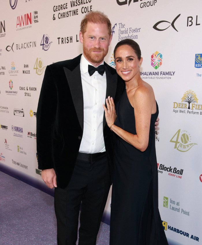 Harry and Meghan pose on a red carpet, their public life contrasting with King Charles' letter about private citizens. Harry and Meghan pose on a red carpet, their public life contrasting with King Charles' letter about private citizens.