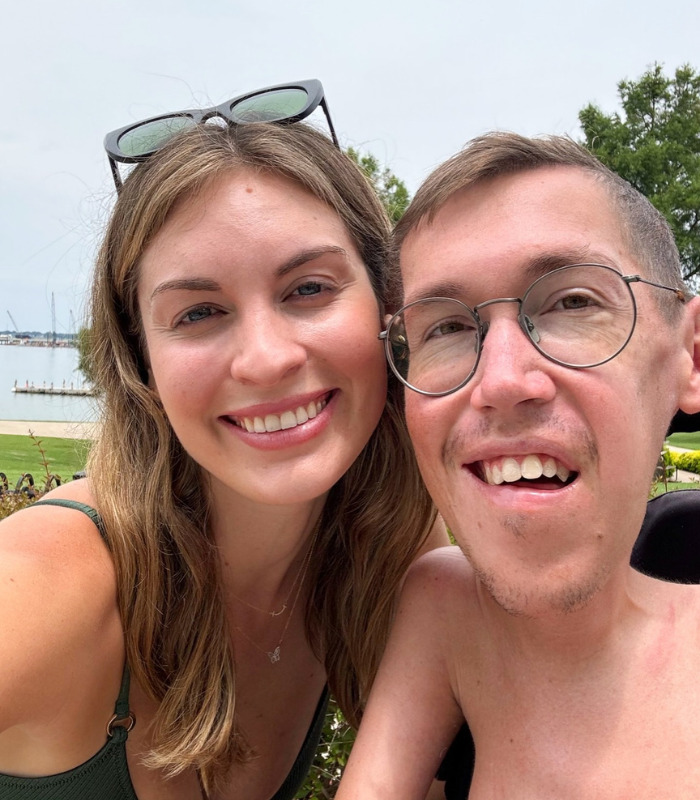 Smiling TikTok stars, a couple, embracing outdoors near water, celebrating their intimacy and upcoming pregnancy. Smiling TikTok stars, a couple, embracing outdoors near water, celebrating their intimacy and upcoming pregnancy.