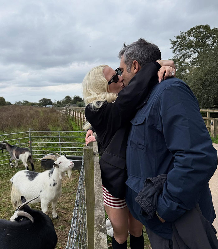 Lady Gaga and Michael Polansky embracing on a farm, facing criticism over their baby girl's name.