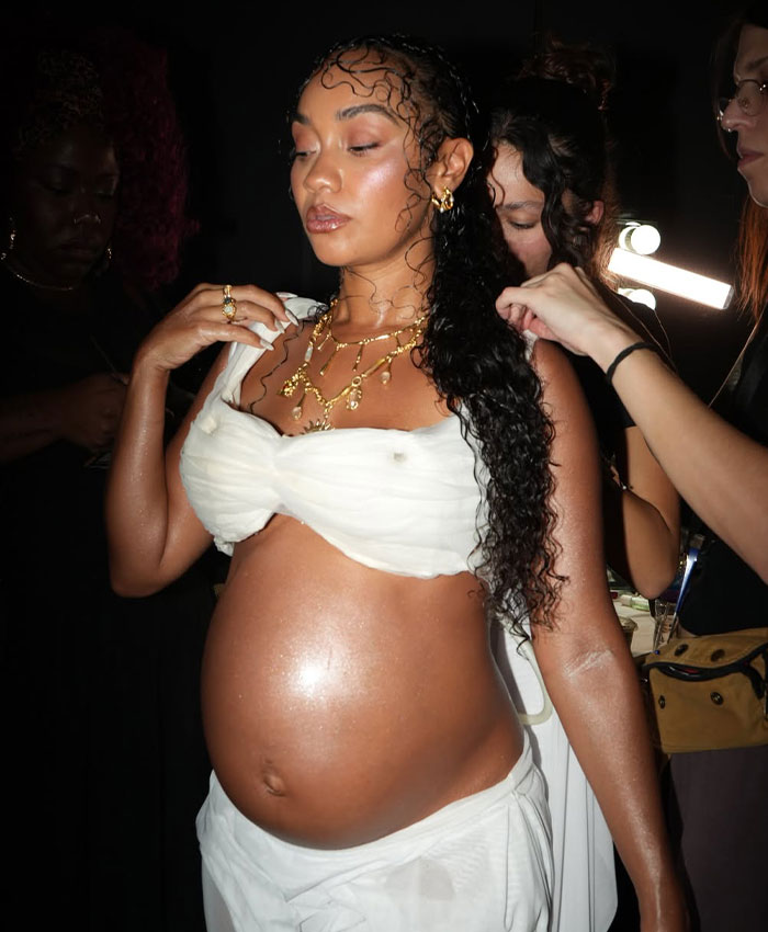 Pregnant star Leigh-Anne Pinnock backstage getting ready for her controversial runway appearance.