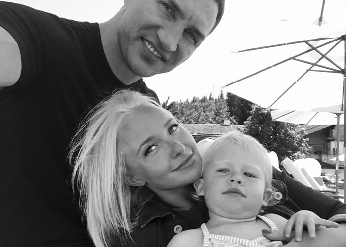 Black and white family photo featuring Hayden Panettiere, her partner, and their young child. Black and white family photo featuring Hayden Panettiere, her partner, and their young child.