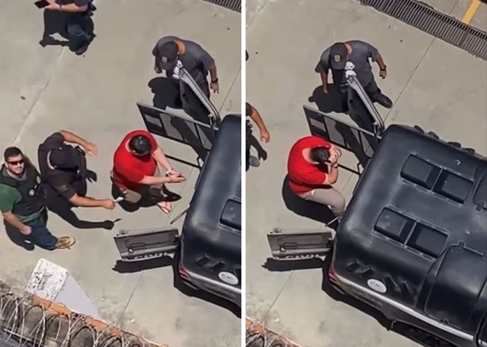 A man arrested in a red t-shirt by police officers A man arrested in a red t-shirt by police officers