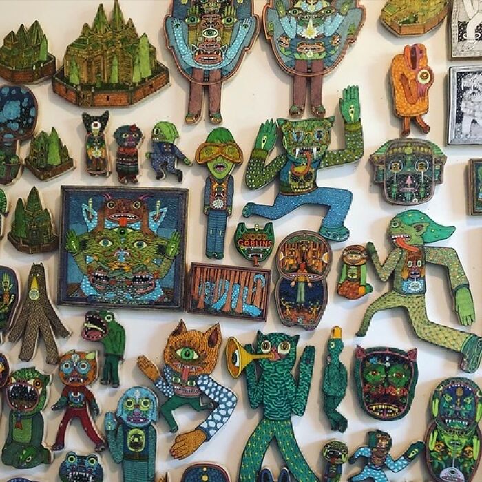Theo Ellsworth collection of small colorful figurines and artworks with various abstract characters