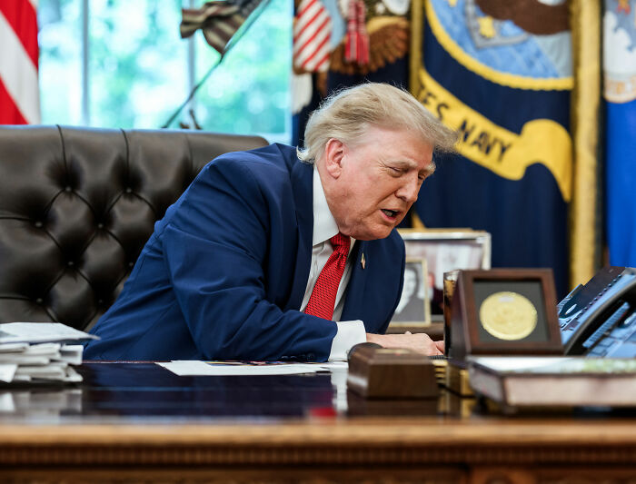 Donald Trump at his desk, seemingly making a decision about the New Mexico name change. Donald Trump at his desk, seemingly making a decision about the New Mexico name change.
