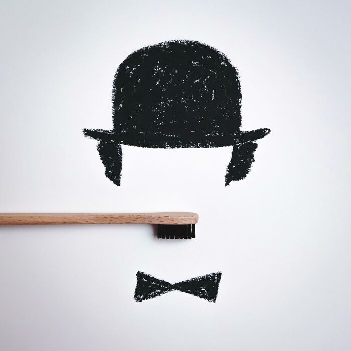 A playful illustration of Charlie Chaplin made with a wooden toothbrush and chalk sketches