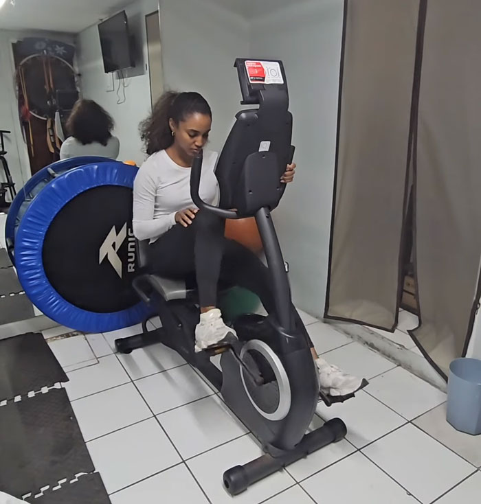 Gabrielle Henry exercising on stationary bike during recovery Gabrielle Henry exercising on stationary bike during recovery