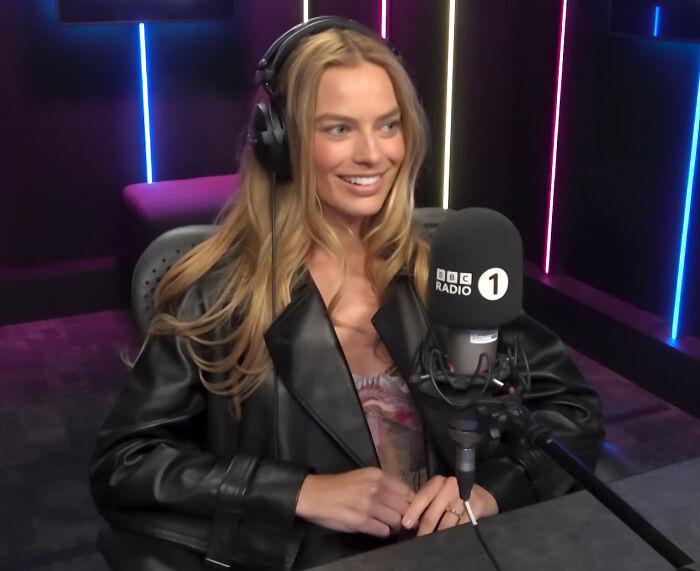 Margot Robbie smiling in BBC Radio 1 studio interview Margot Robbie smiling in BBC Radio 1 studio interview