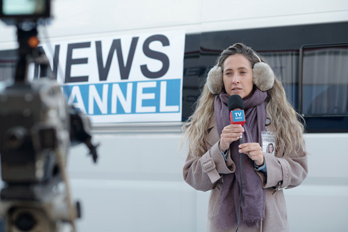 A reporter from a news channel reporting outside, making students famous for their home bar and loud parties. A reporter from a news channel reporting outside, making students famous for their home bar and loud parties.