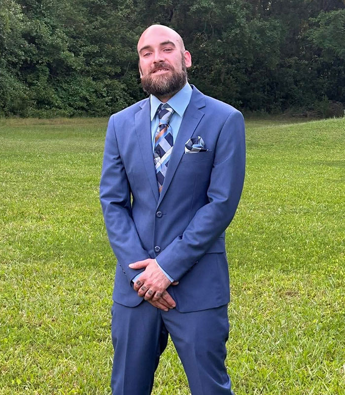 Man in a blue suit, the attacker's victim, whose last words identified his children's mother. Man in a blue suit, the attacker's victim, whose last words identified his children's mother.