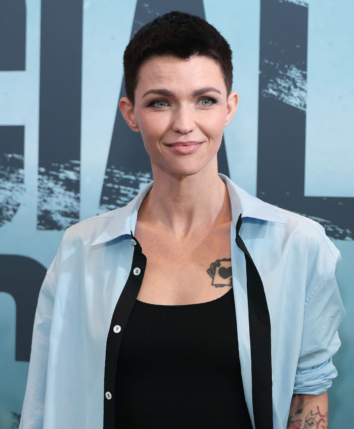 Ruby Rose smiling while posing at a red carpet event Ruby Rose smiling while posing at a red carpet event
