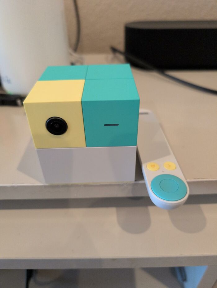 A colorful toy cube camera with its remote control, a featured item from Prime Big Deal Days