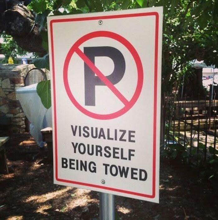 A funny sign with a No Parking symbol and the text Visualize Yourself Being Towed.