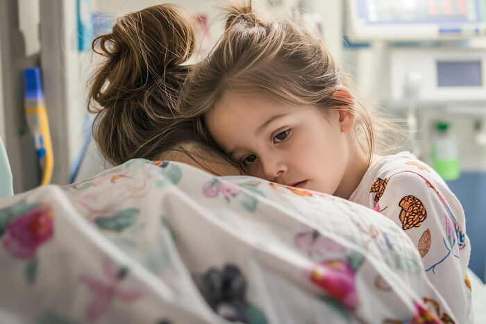A worried child hugging her mother in a hospital room, highlighting how strange patients and families seek care