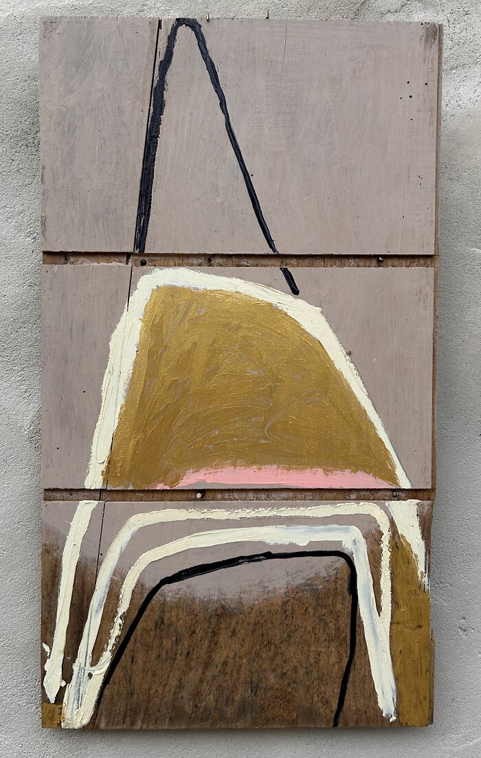 Creative art by Heather Chontos: an abstract painting featuring a prominent gold shape on a textured wooden surface.