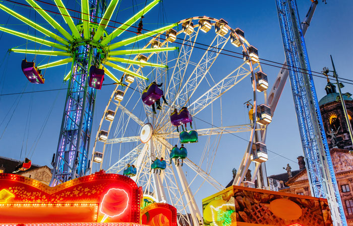 A vibrant amusement park at dusk featuring a Ferris wheel, representing a sister and brother finding joy together A vibrant amusement park at dusk featuring a Ferris wheel, representing a sister and brother finding joy together