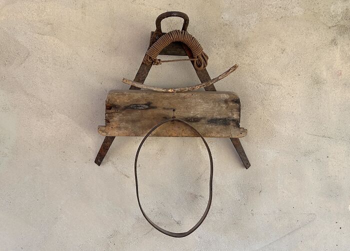 A rustic assemblage of wood, metal, and rope creating a unique piece of creative art by Heather Chontos.