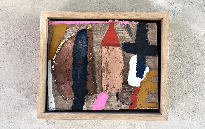 Heather Chontos creative art, an abstract piece with geometric shapes and earthy tones, framed in wood.