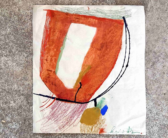 A piece of creative art by Heather Chontos on paper, showcasing an abstract orange shape with colorful scribbles.
