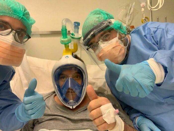 Medical staff and a patient with a 3D printed mask, demonstrating brilliant applications of 3D printers.