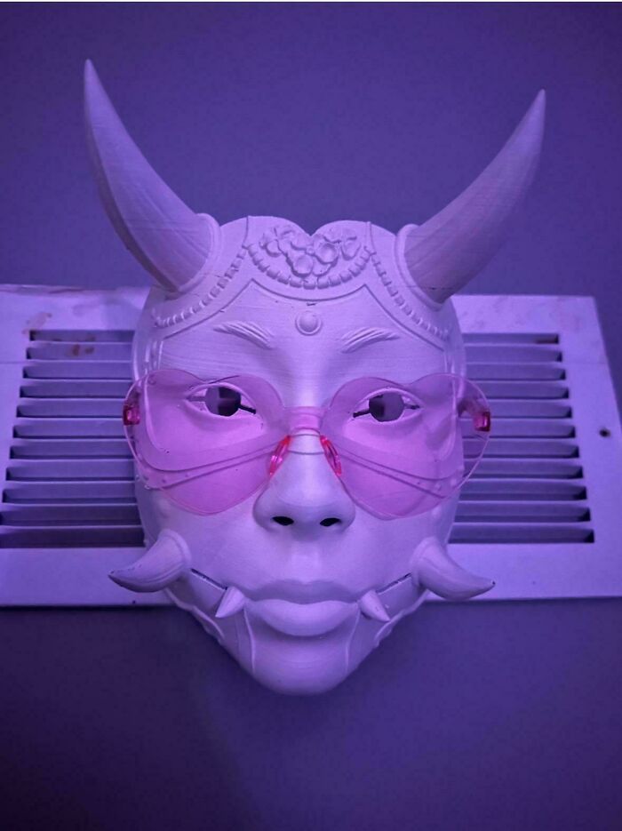 An elaborate horned mask with pink glasses, a brilliant creation made using 3D printers.