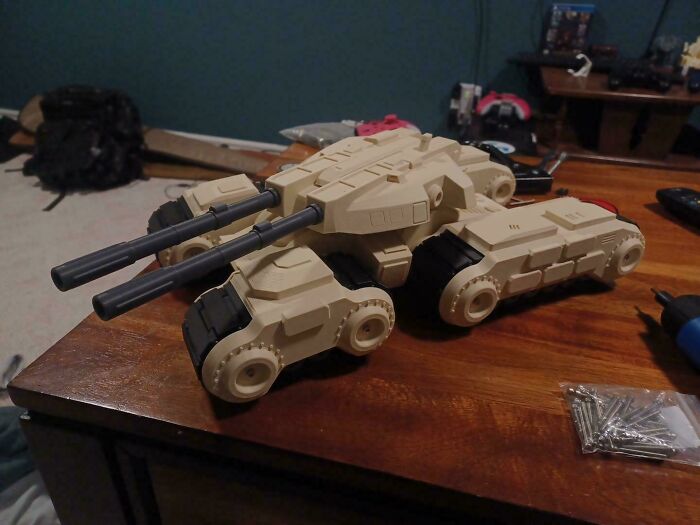 Large tan and gray 3D printed tank model on a wooden table, brilliant stuff.