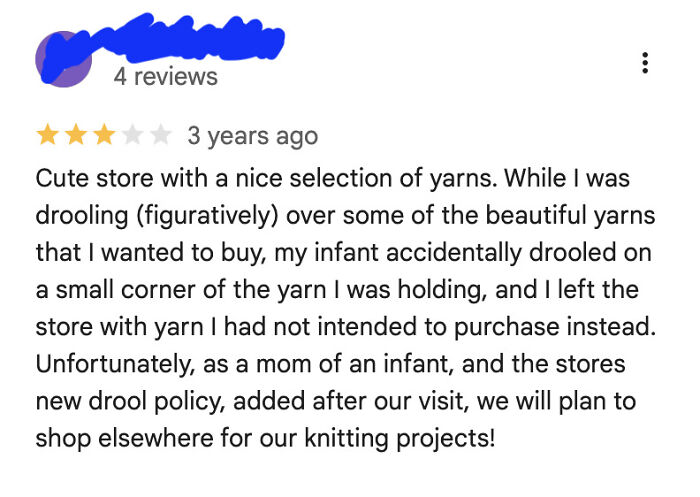 A customer review for yarn, complaining about infant drool, part of 65 reviews needing a reality check.