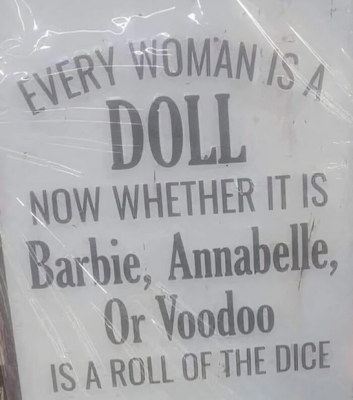 A silly sign saying, Every woman is a doll. Now whether it is Barbie, Annabelle, or Voodoo is a roll of the dice.