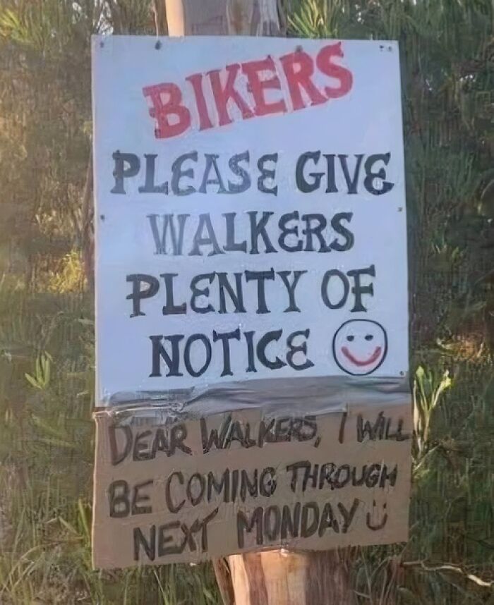 A silly-funny-sign for bikers asking to give walkers notice, with a humorous note from a walker below.