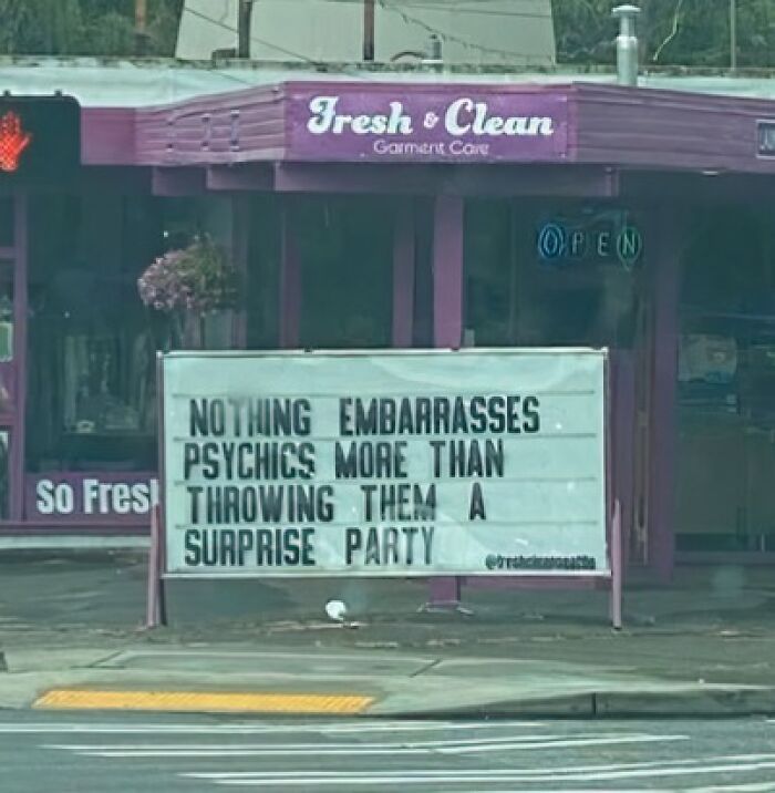 A silly funny sign outside a laundromat: Nothing embarrasses psychics more than throwing them a surprise party.