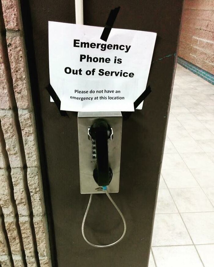 A sign at airports stating Emergency Phone is Out of Service, with a humorous warning, one of the weird things spotted.