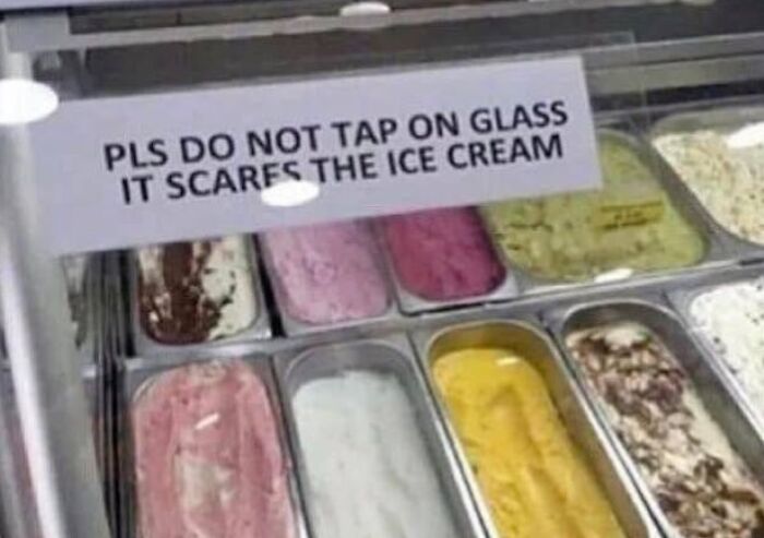 A funny sign on an ice cream freezer that reads Pls Do Not Tap on Glass It Scares the Ice Cream.