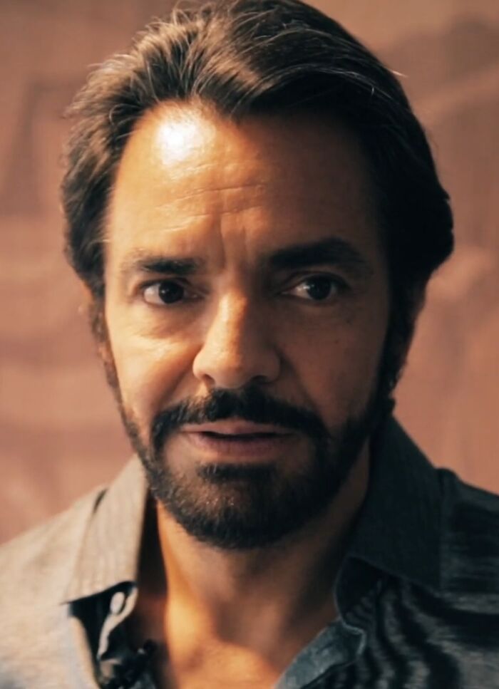 Eugenio Derbez looking directly at the camera, showcasing his career highlights and bio.
