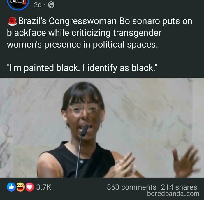 A woman in blackface, speaking into a microphone, illustrating people being unbelievably stupid.