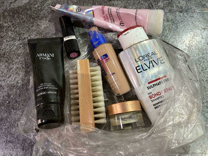 A clear plastic bag filled with various used toiletries and cosmetics, representing an unhinged Vinted offering.