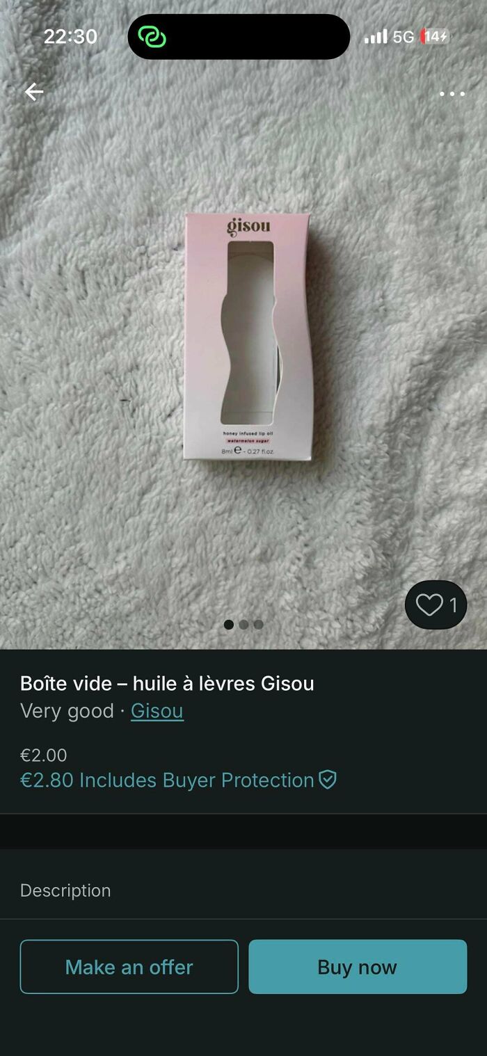 An unhinged Vinted post of an empty Gisou lip oil box for sale on a white textured surface.