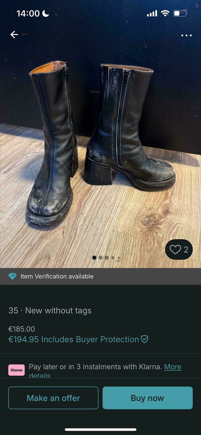A pair of heavily used black boots with zippers, listed for sale on Vinted, an example of unhinged Vinted posts.