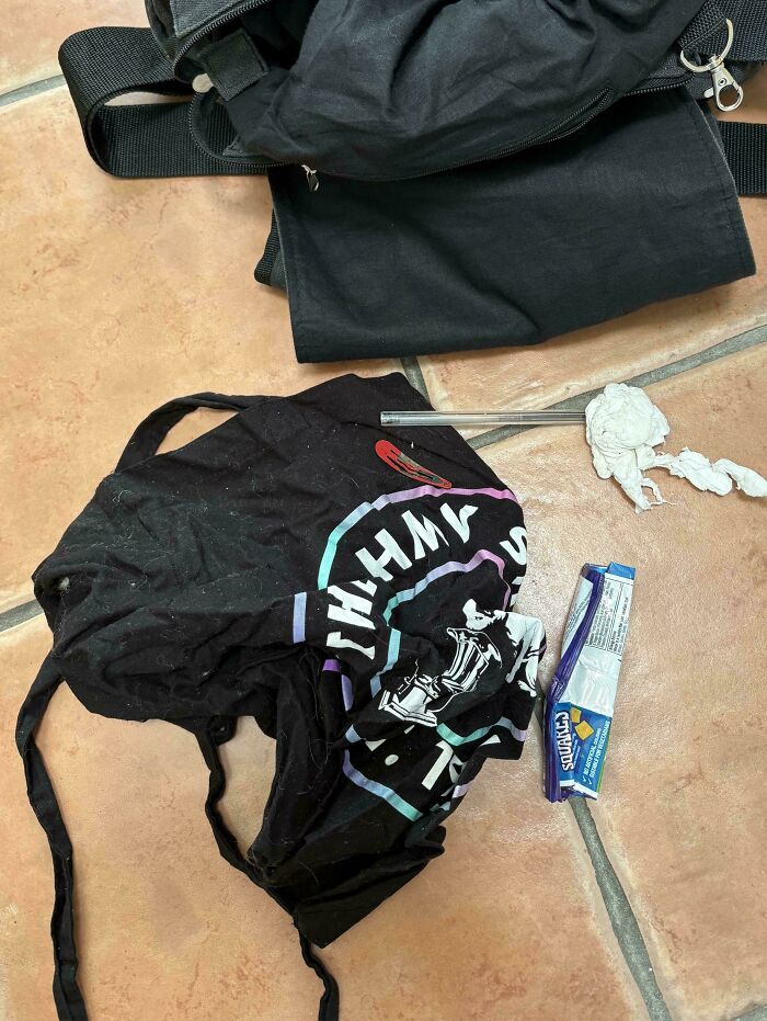 A discarded Vinted package with a used clothing item and an unhinged Vinted post.