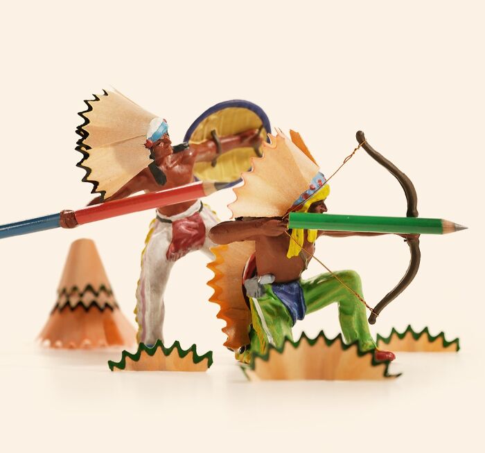 Miniature Calendar work by Tatsuya Tanaka depicting native figures made from pencil shavings aiming a pencil bow.