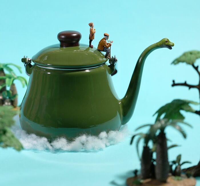 Miniature calendar works by Tatsuya Tanaka: two tiny figures on a green kettle resembling a tropical island.
