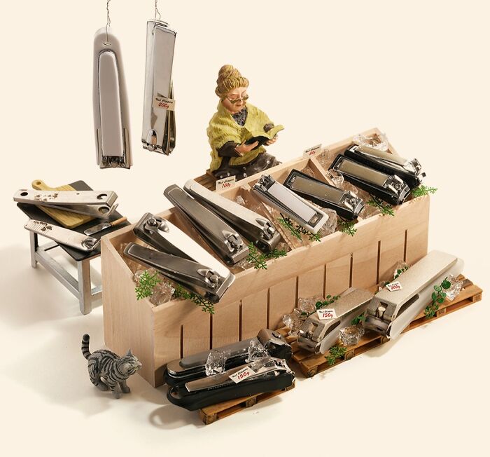 Miniature calendar works by Tatsuya Tanaka: a tiny market stall made from nail clippers and a figurine browsing.