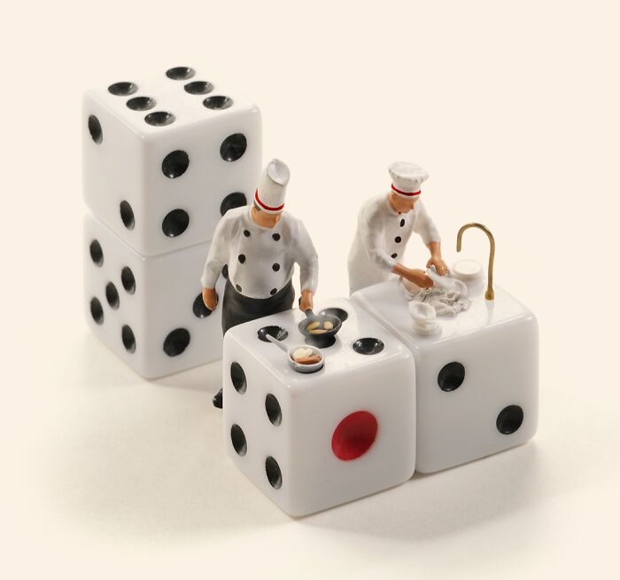 Miniature Calendar work by Tatsuya Tanaka: tiny chefs cooking and washing dishes on giant dice.