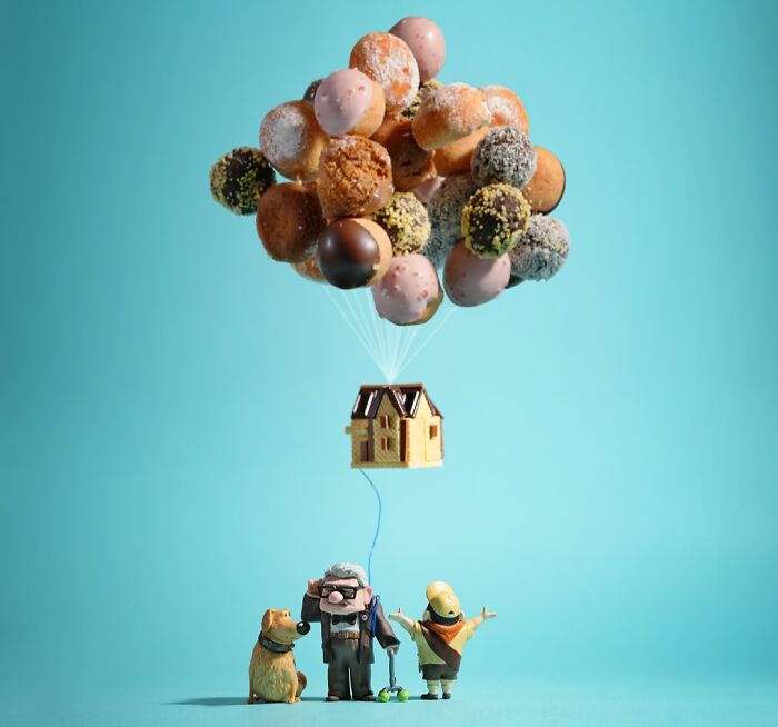 Miniature calendar scene by Tatsuya Tanaka featuring a house lifted by donut balloons with small figures.