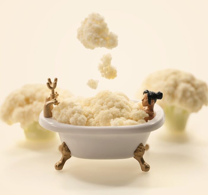 Miniature Calendar Works by Tatsuya Tanaka showing a tiny figure bathing in a tub filled with cauliflower florets.