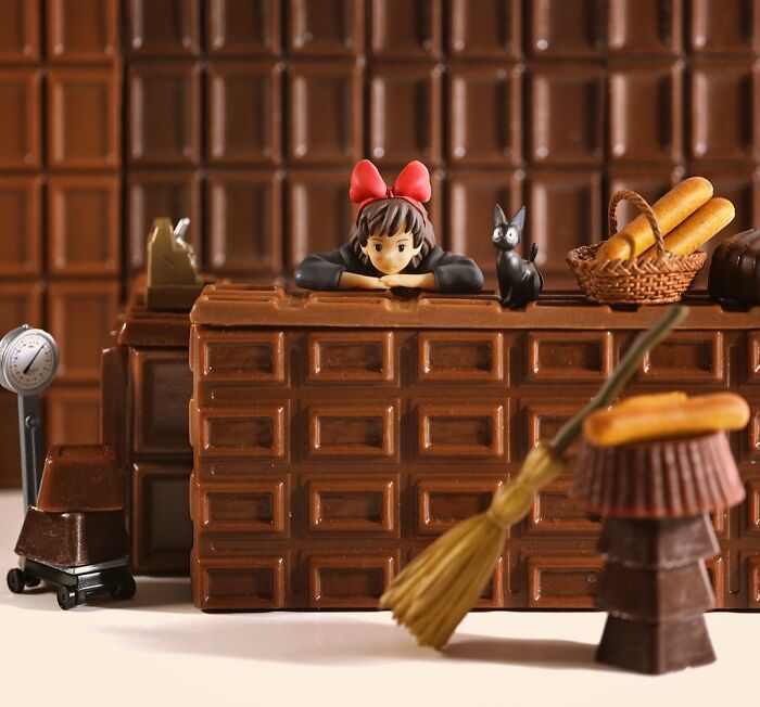 Miniature calendar works by Tatsuya Tanaka: Kiki's Delivery Service miniature scene on a chocolate bar background.